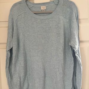 Light blue sweater, not super thick